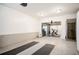 Spacious garage with a dedicated workout area featuring gym equipment and a temperature-controlled wine storage unit at 588 Bismark Ne Rd, Atlanta, GA 30324