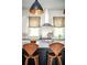 This kitchen includes a large kitchen island with seating, and modern stainless steel appliances at 588 Bismark Ne Rd, Atlanta, GA 30324
