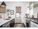 Modern kitchen features stainless steel appliances, dark hardwood floors and stylish pendant lighting at 588 Bismark Ne Rd, Atlanta, GA 30324