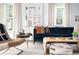 Comfortable living room featuring a blue sofa, stylish coffee table, and bright, airy atmosphere at 588 Bismark Ne Rd, Atlanta, GA 30324