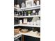 Organized walk-in pantry with ample shelving and stylish decor elements against black backdrop at 588 Bismark Ne Rd, Atlanta, GA 30324