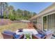 Inviting backyard patio featuring a fire pit and comfortable seating for outdoor relaxation and entertainment at 6550 Lantana Village Way, Cumming, GA 30028