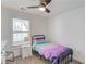 Small bedroom with ceiling fan and bright window at 6550 Lantana Village Way, Cumming, GA 30028