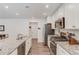Well-lit kitchen featuring stainless steel appliances, granite countertops and modern fixtures at 6550 Lantana Village Way, Cumming, GA 30028