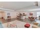 Open-concept living space with a kitchen island, dining area, and living area that offers versatile layout options at 6550 Lantana Village Way, Cumming, GA 30028