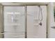 Shower stall showcasing adjustable shower head and built-in shelving at 6550 Lantana Village Way, Cumming, GA 30028