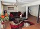 Finished basement with a cozy seating area, plush rug, and a view of the stairway at 6695 Cedar Hurst Trl, Atlanta, GA 30349