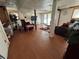 Spacious finished basement with ample seating, wood-look flooring, and a walkout to the yard at 6695 Cedar Hurst Trl, Atlanta, GA 30349