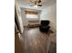 This bedroom is furnished with modern hardwood floors and a ceiling fan at 6695 Cedar Hurst Trl, Atlanta, GA 30349
