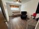 This living room is furnished with modern hardwood floors and a ceiling fan at 6695 Cedar Hurst Trl, Atlanta, GA 30349