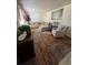 Comfortable living room featuring a large sectional sofa, stylish decor, and wood-look floors at 6695 Cedar Hurst Trl, Atlanta, GA 30349