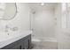 Clean bathroom with a tub shower, white subway tile, and dark vanity at 1050 Willeo Ct, Marietta, GA 30068