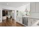 Bright, eat-in kitchen with farmhouse sink, marble countertops and stainless appliances at 1050 Willeo Ct, Marietta, GA 30068