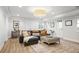 Open concept living room with neutral colors, modern fixtures, and hardwood floors at 1050 Willeo Ct, Marietta, GA 30068