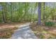 Paved footpath with foot prints leading through the woods at 1050 Willeo Ct, Marietta, GA 30068