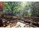 Enjoy outdoor living on this beautiful wooden deck surrounded by lush greenery at 1400 Hidden Circle Dr, Sugar Hill, GA 30518