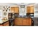 Updated kitchen with a breakfast bar, dark countertops, and stainless steel appliances at 1400 Hidden Circle Dr, Sugar Hill, GA 30518
