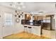 Well-lit kitchen with breakfast bar, stainless steel appliances, and stylish accents at 1400 Hidden Circle Dr, Sugar Hill, GA 30518