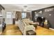 Inviting living room with hardwood floors, ceiling fan, and eclectic decor at 1400 Hidden Circle Dr, Sugar Hill, GA 30518