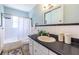 Clean bathroom featuring white subway tile, dark countertop, and neutral fixtures at 1740 Fairbanks Sw St, Atlanta, GA 30310