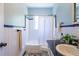Classic bathroom with white tile, black trim, and a window over the tub at 1740 Fairbanks Sw St, Atlanta, GA 30310