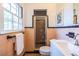 Vintage bathroom featuring peach tile, a shower, a white vanity, and a bright window at 1740 Fairbanks Sw St, Atlanta, GA 30310