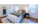 Cozy bedroom with a plush bed, soft rug, and natural light from the windows at 1740 Fairbanks Sw St, Atlanta, GA 30310