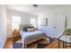 Bright bedroom featuring wood floors, natural light, and neutral tones at 1740 Fairbanks Sw St, Atlanta, GA 30310