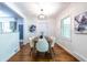 Dining room featuring a chandelier and hardwood floors with lots of natural light at 1740 Fairbanks Sw St, Atlanta, GA 30310