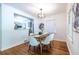 Dining room area with hardwood floors, chandelier, and view of the kitchen at 1740 Fairbanks Sw St, Atlanta, GA 30310