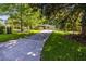 Quaint home with a concrete driveway and green lawn at 1740 Fairbanks Sw St, Atlanta, GA 30310