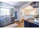 The sage kitchen features stainless appliances, a bright window, and an open floor plan at 1740 Fairbanks Sw St, Atlanta, GA 30310