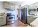 Charming kitchen featuring sage cabinetry, stainless steel appliances, and ample counter space at 1740 Fairbanks Sw St, Atlanta, GA 30310