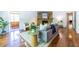 Spacious living area with hardwood floors, a stone fireplace, and stylish decor, perfect for relaxing and entertaining at 1740 Fairbanks Sw St, Atlanta, GA 30310