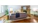 Bright living room showcasing hardwood floors, a stone fireplace, stylish furniture, and an inviting atmosphere at 1740 Fairbanks Sw St, Atlanta, GA 30310