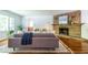 Elegant living room with hardwood floors, a stone fireplace, and comfortable seating, creating a cozy atmosphere at 1740 Fairbanks Sw St, Atlanta, GA 30310