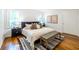 Inviting main bedroom with hardwood floors, white walls, and a comfortable aesthetic at 1740 Fairbanks Sw St, Atlanta, GA 30310