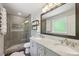 Modern bathroom features a glass enclosed shower with subway tiles, a double sink vanity, and a large mirror at 2789 Townley Cir, Atlanta, GA 30340