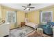 Cheerful bedroom with yellow walls, plenty of natural light, and colorful accents at 2789 Townley Cir, Atlanta, GA 30340