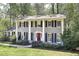 Charming two-story home with a classic brick facade, black shutters, and a well-manicured front lawn at 2789 Townley Cir, Atlanta, GA 30340
