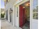Charming front entrance with gray brick, black shutters, and a vibrant red door at 2789 Townley Cir, Atlanta, GA 30340