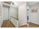 Upstairs hallway featuring hardwood floors and white trim, leading to various rooms at 2789 Townley Cir, Atlanta, GA 30340