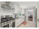 Updated kitchen featuring stainless steel appliances, ample counter space, subway tile backsplash, and plenty of storage at 2789 Townley Cir, Atlanta, GA 30340