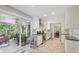 Stylish kitchen with stainless steel appliances and access to a cozy porch with outdoor seating and beautiful greenery at 2789 Townley Cir, Atlanta, GA 30340