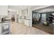 Spacious kitchen transitioning into the living room with white cabinets and stainless steel appliances at 2789 Townley Cir, Atlanta, GA 30340