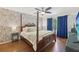Primary bedroom suite showcasing hardwood floors, four poster bed, and colorful wallpaper at 2789 Townley Cir, Atlanta, GA 30340