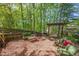 Backyard with patio area, wood fencing, fire pit, grill and outdoor furniture at 5108 Staplehurst Ln, Woodstock, GA 30189