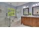 Bright bathroom with a glass-enclosed shower, soaking tub, and a double sink vanity at 5108 Staplehurst Ln, Woodstock, GA 30189