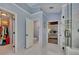 Well lit bathroom featuring a walk-in closet, toilet room, bedroom access, and a glass shower at 5108 Staplehurst Ln, Woodstock, GA 30189