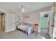 Bedroom featuring a daybed, plush carpeting, and doors leading to a closet and the hallway at 5108 Staplehurst Ln, Woodstock, GA 30189